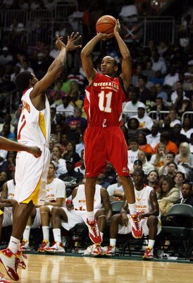 CORAL GABLES, FL - APRIL 01:  Avery Bradley Jr. #11 of the West Team shoots over Dexter Strickland #7 of the East Team in the 2009 McDonald's All American Men's High School Basketball Game at BankUnited Center on April 1, 2009 in Coral Gables, Florida.  (