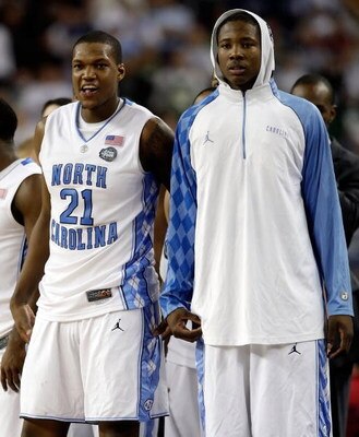 DETROIT - APRIL 06:  Deon Thompson #21 and Ed Davis #32 of the North Carolina Tar Heels look on from the bench late in the second half before the Tar Heels 89-72 win against the Michigan State Spartans during the 2009 NCAA Division I Men's Basketball Nati
