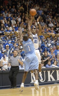 DURHAM, NC - FEBRUARY 7: DeMarcus Nelson #21 of the Duke University Blue Devils makes a jumpshot overMarcus Ginyard #1 of the North Carolina Tar Heels during the game on February 7, 2007 at Cameron Indoor Stadium in Durham, N.C. North Carolina won 79-73. 