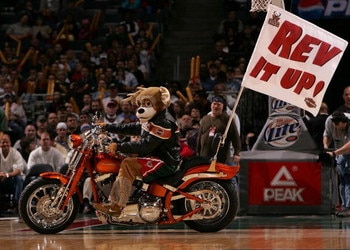 MILWAUKEE - MARCH 07: Bango, the mascot of the Milwaukee Bucks, rides a motorcycle during a break in the action between the Bucks and the Portland Trail Blazers on March 7, 2008 at the Bradley Center in Milwaukee, Wisconsin. The Trail Blazers defeated the