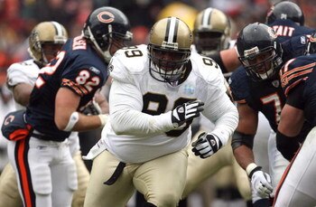 CHICAGO - DECEMBER 30:  Hollis Thomas #99 of the New Orleans Saints rushes the passer against the Chicago Bears at Soldier Field on December 30, 2007 in Chicago, Illinois.  (Photo by Jonathan Daniel/Getty Images)