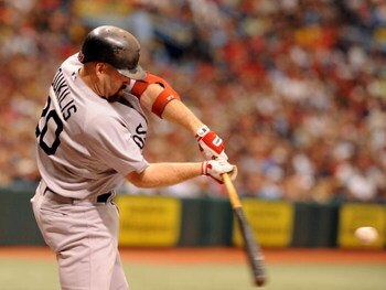 ST. PETERSBURG, FL - MAY 3: Infielder Kevin Youkilis #20 of the Boston Red Sox homers against the Tampa Bay Rays May 3, 2009 at Tropicana Field in St. Petersburg, Florida. (Photo by Al Messerschmidt/Getty Images)