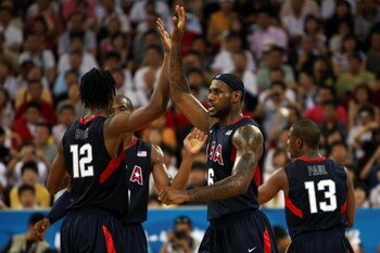 BEIJING - AUGUST 24:  LeBron James #6 and Chris Bosh #12 of the United State celebrate a play in the gold medal game against Spain during Day 16 of the Beijing 2008 Olympic Games at the Beijing Olympic Basketball Gymnasium on August 24, 2008 in Beijing, C