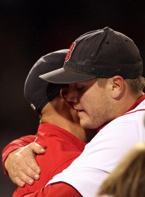 BOSTON - SEPTEMBER 23:  Jonathan Papelbon #58 of the Boston Red Sox is congratulated by manager Terry Francona #47 after the 5-4 win over the Cleveland Indians clinched the Red Sox the Wild Card on September 23, 2008 at Fenway Park in Boston, Massachusett