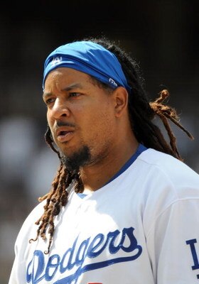 LOS ANGELES, CA - APRIL 19:  Manny Ramirez #99 of the Los Angeles Dodgers on base against the Colorado Rockies during the game at Dodger Stadium on April 19, 2009 in Los Angeles, California.  (Photo by Harry How/Getty Images)
