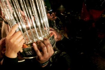 HOUSTON - OCTOBER 26:  The Championship trophy is passed around the Chicago White Sox locker room after winning Game Four of the 2005 Major League Baseball World Series against the Houston Astros at Minute Maid Park on October 26, 2005 in Houston, Texas. 