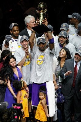 ORLANDO, FL - JUNE 14:  Kobe Bryant #24 of the Los Angeles Lakers celebrates with the Larry O'Brien Trophy after defeating the Orlando Magic 99-86 in Game Five of the 2009 NBA Finals on June 14, 2009 at Amway Arena in Orlando, Florida.  NOTE TO USER:  Use