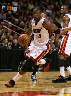 MIAMI - MAY 01:  Dwyane Wade #3 of the Miami Heat penetrates against the Atlanta Hawks during Game Six of the Eastern Conference Quarterfinals at American Airlines Arena on May 1, 2009 in Miami, Florida. NOTE TO USER: User expressly acknowledges and agree
