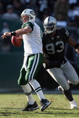 OAKLAND, CA - OCTOBER 19:  Brett Favre #4 of the New York Jets passes under pressure from Tommy Kelly #93 of the Oakland Raiders on October 19, 2008 at the Oakland-Alameda County Coliseum in Oakland, California. (Photo by Jed Jacobsohn/Getty Images)