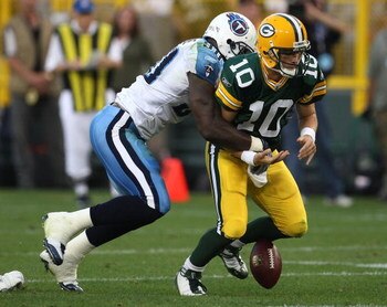 GREEN BAY, WI - AUGUST 28: Jevon Kearse #90 of the Tenessee Titans strips the ball from Matt Flynn #10 of the Green Bay Packers on August 28, 2008 at Lambeau Field in Green Bay, Wisconsin. (Photo by Jonathan Daniel/Getty Images)