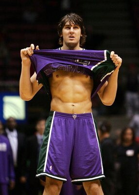 EAST RUTHERFORD, NEW JERSEY - NOVEMBER 2:  Andrew Bogut #6 of the Milwaukee Bucks lifts his jersey during NBA action against the New Jersey Nets November 2, 2005 at Continental Airlines Arena in East Rutherford, New Jersey. The Bucks defeated the Nets 110