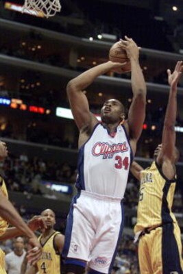 8 Jan 2001:  Michael Olowokandi #34 of the Los Angeles Clippers puts a shot up against the Indiana Pacers during their game at the Staples Center in Los Angeles, California.  DIGITAL IMAGE Mandatory Credit: Christopher Ruppel/ALLSPORT. NOTE TO USER: It is