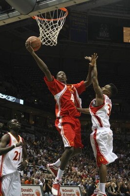 MILWAUKEE - MARCH 26:  Al-Farouq Aminu #42 of the East team goes to the basket against Jrue Holiday #21 and Brandon Jennings #3 of the West team during the 2008 McDonald's All American High School Boys basketball game on March 26, 2008 at the Bradley Cent