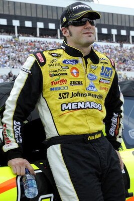 LONG POND, PA - JUNE 07: Paul Menard, driver of the #96 Pittsburgh Paints/Menards Ford stands on pit road before the start of  the NASCAR Sprint Cup Series Pocono 500 on June 7, 2009 at Pocono Raceway in Long Pond, Pennsylvania.  (Photo by John Harrelson/