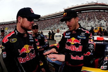 BRISTOL, TN - MARCH 21:  Scott Speed (R), driver of the #99 Red Bull Toyota, talks with Cup teammate Brian Vickers, driver of the #83 Red Bull Toyota, on the grid prior to the start of the NASCAR Nationwide Series Scotts Turf Builder 300 at Bristol Motor 