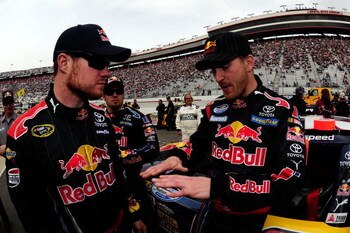 BRISTOL, TN - MARCH 21:  Scott Speed (R), driver of the #99 Red Bull Toyota, talks with Cup teammate Brian Vickers, driver of the #83 Red Bull Toyota, on the grid prior to the start of the NASCAR Nationwide Series Scotts Turf Builder 300 at Bristol Motor 