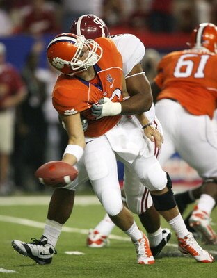 ATLANTA - AUGUST 30:  Quarterback Cullen Harper #10 of the Clemson Tigers throws an under handed pass as he is hit by defensive lineman Lorenzo Washington #97 of the Alabama Crimson Tide at the Georgia Dome on August 30, 2008 in Atlanta, Georgia.  (Photo 