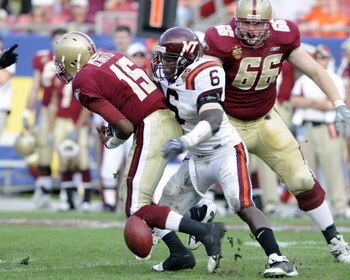 TAMPA, FL - DECEMBER 6: Defensive end Jason Worilds #6 of the Virginia Tech Hokies forces a fumble by quarterback Dominique Davis #15 of the Boston College Eagles in the 2008 ACC Football Championship game at Raymond James Stadium on December 6, 2008 in T