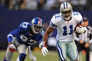EAST RUTHERFORD, NJ - NOVEMBER 02:  Roy Williams #11 of the Dallas Cowboys catches a pass as Corey Webster #23 of the New York Giants defends during their game on November 2, 2008 at Giants Stadium in East Rutherford, New Jersey.  (Photo by Al Bello/Getty