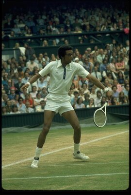 JUN 1975:  ARTHUR ASHE OF THE UNITED STATES HITS A BACKHAND ON THE CENTRE COURT AT WIMBLEDON DURING THE MENS SINGLES.
