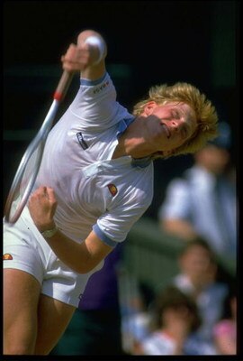 JUN 1985:  BORIS BECKER OF WEST GERMANY MAKES A POWERFUL SERVE DURING A MATCH AT THE 1985 WIMBLEDON TENNIS CHAMPIONSHIPS.