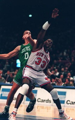 1994-1995:  NEW YORK KNICKS CENTER PATRICK EWING BATTLES FOR REBOUNDING POSITION WITH ERIC MONTROSS OF THE BOSTON CELTICS DURING THEIR GAME AT MADISON SQUARE GARDEN IN NEW YORK, NEW YORK.   Mandatory Credit: Simon Bruty/ALLSPORT