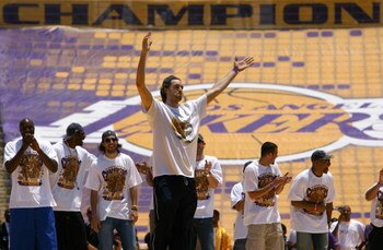 LOS ANGELES, CA - JUNE 17:  (L-R) Lamar Odom, DJ Mbenga, Sasha Vujacic, Pau Gasol (C), Jordan Farmar and Derek Fisher of the Los Angeles Lakers celebrate on stage during the 2009 NBA Championship Victory Parade and Rally at the Los Angeles Memorial Colise