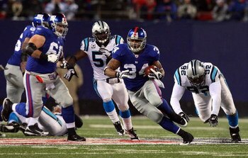 EAST RUTHERFORD, NJ - DECEMBER 21:  Derrick Ward #34 of the New York Giants runs the ball against the Carolina Panthers on December 21, 2008 at Giants Stadium in East Rutherford, New Jersey.  (Photo by Jim McIsaac/Getty Images)