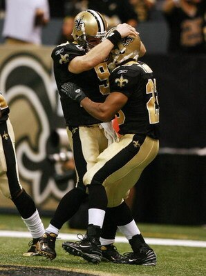 NEW ORLEANS - OCTOBER 21:  Quarterback Drew Brees #9 of the New Orleans Saints congratulates running back Pierre Thomas #23 after Thomas scored against the Atlanta Falcons at the Superdome on October 21, 2007 in New Orleans, Louisiana. The Saints defeated
