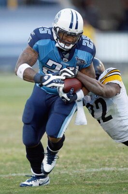 NASHVILLE,TN - DECEMBER 21:  Lendale White #25 of the Tennessee Titans carries the ball as he is grabbed by William Gay #22 of the Pittsburgh Steelers on December 21, 2008 at LP Field in Nashville, Tennessee. (Photo by: Streeter Lecka/Getty Images)