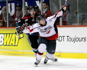 RIMOUSKI, QC - MAY 24:   Ryan Ellis #6 of the Windsor Spitfires gets held by Jamie Benn #14 of the Kelowna Rockets during the 2009 Mastercard Memorial Cup Final at the Rimouski Colisee on May 24, 2009 in Rimouski, Quebec, Canada.  (Photo by Richard Wolowi