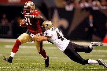 NEW ORLEANS - SEPTEMBER 28:  Frank Gore #21 of the San Francisco 49ers is tackled by Kevin Kaesviharn #43 of the New Orleans Saints on September 28 2008 at the Superdome in New Orleans, Louisiana.  The Saints defeated the 49ers 31-17.  (Photo by Chris Gra