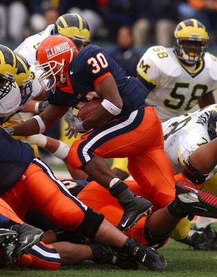 CHAMPAIGN, IL - OCTOBER 16: Pierre Thomas #30 of Illinois runs against Michigan during a game at Memorial Stadium October 16, 2004 in Champaign, Illinois. Michigan defeated Illinois 30-19. (Photo by Jonathan Daniel/Getty Images)
