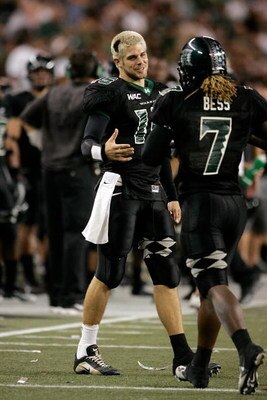 HONOLULU - SEPTEMBER 22:  University of Hawaii Warriors QB #15 Colt Brennan, left, congratulates WR #7 Davone Bess after Bess ran in a touchdown during the fourth quarter against the Charleston Southern Buccaneers at Aloha Stadium, September 22, 2007 in H