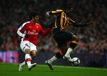 LONDON - MARCH 17:  Carlos Vela of Arsenal challenges Kamil Zayatte of Hull City during the the FA Cup Sponsored by E.on sixth round match between Arsenal and Hull City at Emirates Stadium on March 17, 2009 in London, England.  (Photo by Ryan Pierse/Getty