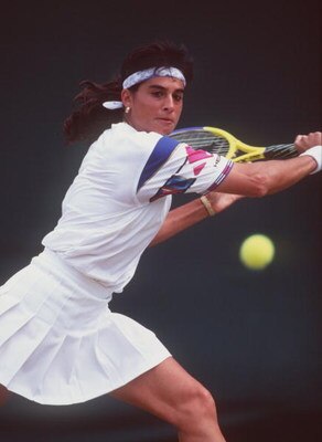 3 JUL 1995:  GABRIELA SABATINI OF ARGENTINA HITS A BACKHAND RETURN AGAINST LISA RAYMOND OF THE USA AT WIMBLEDON. SABATINI WON THE MATCH IN THREE SETS 6-0, 3-6, 7-5. Mandatory Credit: Clive Brunskill/ALLSPORT