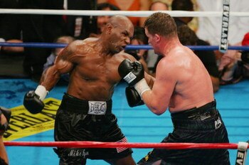 WASHINGTON - JUNE 11:  Mike Tyson throws a punch at Kevin McBride during their heavyweight bout on June 11, 2005 at the MCI Center in Washington, DC.  McBride was declared winner when Tyson quit after the sixth round. (Photo By Jamie Squire/Getty Images)