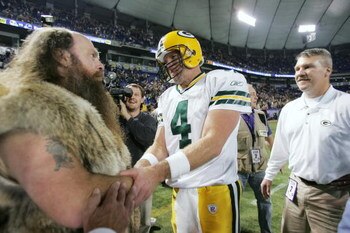 MINNEAPOLIS - NOVEMBER 12:  Quarterback Brett Favre #4 of the Green Bay Packers greets the Minnesota Vikings mascot Ragnar the Viking following the game on November 12, 2006 at the Metrodome in Minneapolis, Minnesota. The Packers defeated the Vikings 23-1