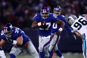 EAST RUTHERFORD, NJ - DECEMBER 21:  Running back Brandon Jacobs #27 of the New York Giants runs against the Carolina Panthers on December 21, 2008 at Giants Stadium in East Rutherford, New Jersey.  (Photo by Chris McGrath/Getty Images)