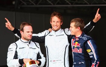 BARCELONA, SPAIN - MAY 09:  (L-R) Third placed Rubens Barrichello of Brazil and Brawn GP, pole sitter Jenson Button of Great Britain and Brawn GP and second placed Sebastian Vettel of Germany and Red Bull Racing celebrate in parc ferem following qualifyin