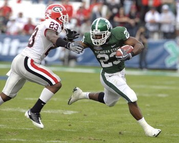 ORLANDO, FL - JANUARY 1: Running back Javon Ringer #23 of the Michigan State Spartans rushes upfield against the Georgia Bulldogs at the 2009 Capital One Bowl at the Citrus Bowl on January 1, 2009 in Orlando, Florida.  (Photo by Al Messerschmidt/Getty Ima