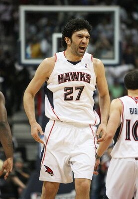 ATLANTA - MAY 03:  Zaza Pachulia #27 of the Atlanta Hawks celebrates after assisting on a basket in the second quarter while taking on the Miami Heat during Game Seven of the Eastern Conference Quarterfinals at Philips Arena on May 3, 2009 in Atlanta, Geo