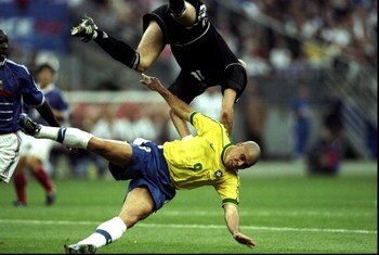12 Jul 1998:  France goalkeeper Fabien Barthez collides with Ronaldo of Brazil during the World Cup Final at the Stade de France in St Denis. France won 3-0. \ Mandatory Credit: Ben Radford /Allsport