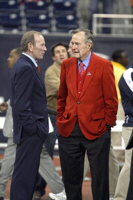 HOUSTON - DECEMBER 13:  President George Herbert Walker Bush talks with the Denver Broncos owner Pat Bowlen before the start of the Houston Texans during the NFL game against the Denver Broncos at  Reliant Stadium on December 13, 2007 in Houston, Texas. (