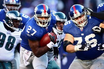 EAST RUTHERFORD, NJ - JANUARY 11:  Brandon Jacobs #27 of the New York Giants runs against the Philadelphia Eagles during the NFC Divisional Playoff Game on January 11, 2009 at Giants Stadium in East Rutherford, New Jersey.  (Photo by Chris McGrath/Getty I