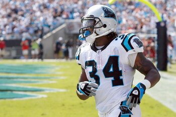 CHARLOTTE, NC - OCTOBER 05:  DeAngelo Williams #34 of the Carolina Panthers jogs on the field during the game against the Kansas City Chiefs at Bank of America on October 5, 2008 in Charlotte, North Carolina.  (Photo by Kevin C. Cox/Getty Images)