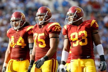 PASADENA, CA - DECEMBER 06:  (L-R) Christian Tupou #44, Fili Moala #75 and Everson Griffen #93 of the USC Trojans smile during the first half against the UCLA Bruins on December 6, 2008 at the Rose Bowl in Pasadena, California.  (Photo by Harry How/Getty 