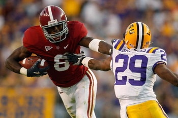 BATON ROUGE, LA - NOVEMBER 08:  Julio Jones #8 of the Alabama Crimson Tide avoids a tackle by Chris Hawkins #29 of the Louisiana State University Tigers  on November 11, 2008 at Tiger Stadium in Baton Rouge, Louisiana. The Tide defeated the Tigers 27-21 i