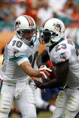 MIAMI - OCTOBER 19: Quarterback Chad Pennington #10 of the Miami Dolphins hands off to teammate Running back Ronnie Brown #23 against the Baltimore Ravens in the first quarter at Dolphin Stadium on October 19, 2008 in Miami, Florida. (Photo by Eliot J. Sc