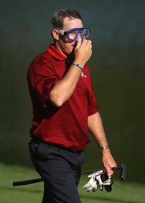 MONTREAL - SEPTEMBER 30:  Woody Austin of the U.S. Team walks to the 14th green wearing a dive mask during the final day singles matches at The Presidents Cup at The Royal Montreal Golf Club on September 30, 2007 in Montreal, Quebec, Canada.  (Photo by Sc